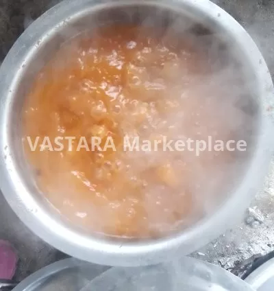 A plate of cooked yellow beans with soups